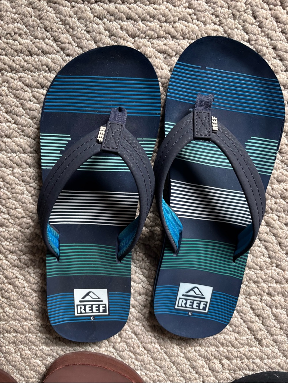 Youth Reef Navy Flip Flops with Teal and Aqua Stripes